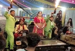Bride groom grand entry with thar on wedding stage with friends