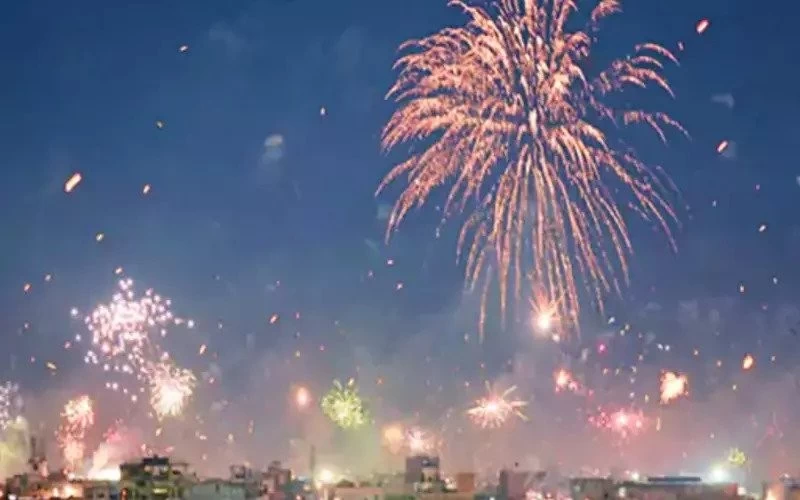 Kite flying in the city by day, fireworks by night; Wishing lamps shine like stars