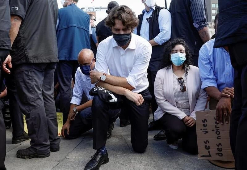 Canada PM Justin Trudeau kneels at anti-racism rally along with protesters