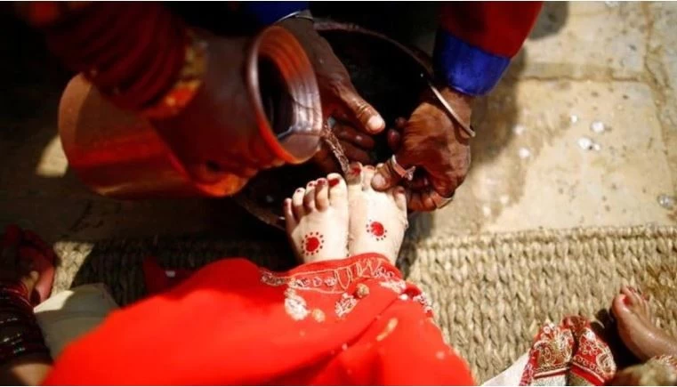 Bengal family worships Muslim girl during Kumari Puja ritual of the Durga Puja festival