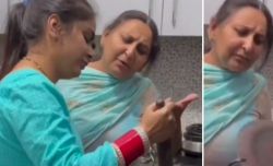 Mother was teaching her daughter how to cook roti in kitchen