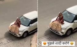 Bride reached outside the groom house sitting on the bonnet of the car then publicly did this