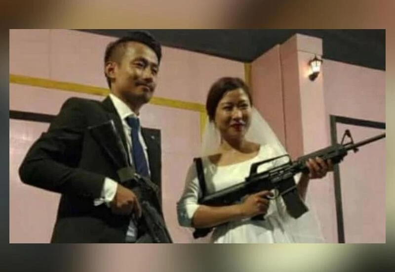 Naga rebel leaders' son, bride pose with assault rifles at their wedding